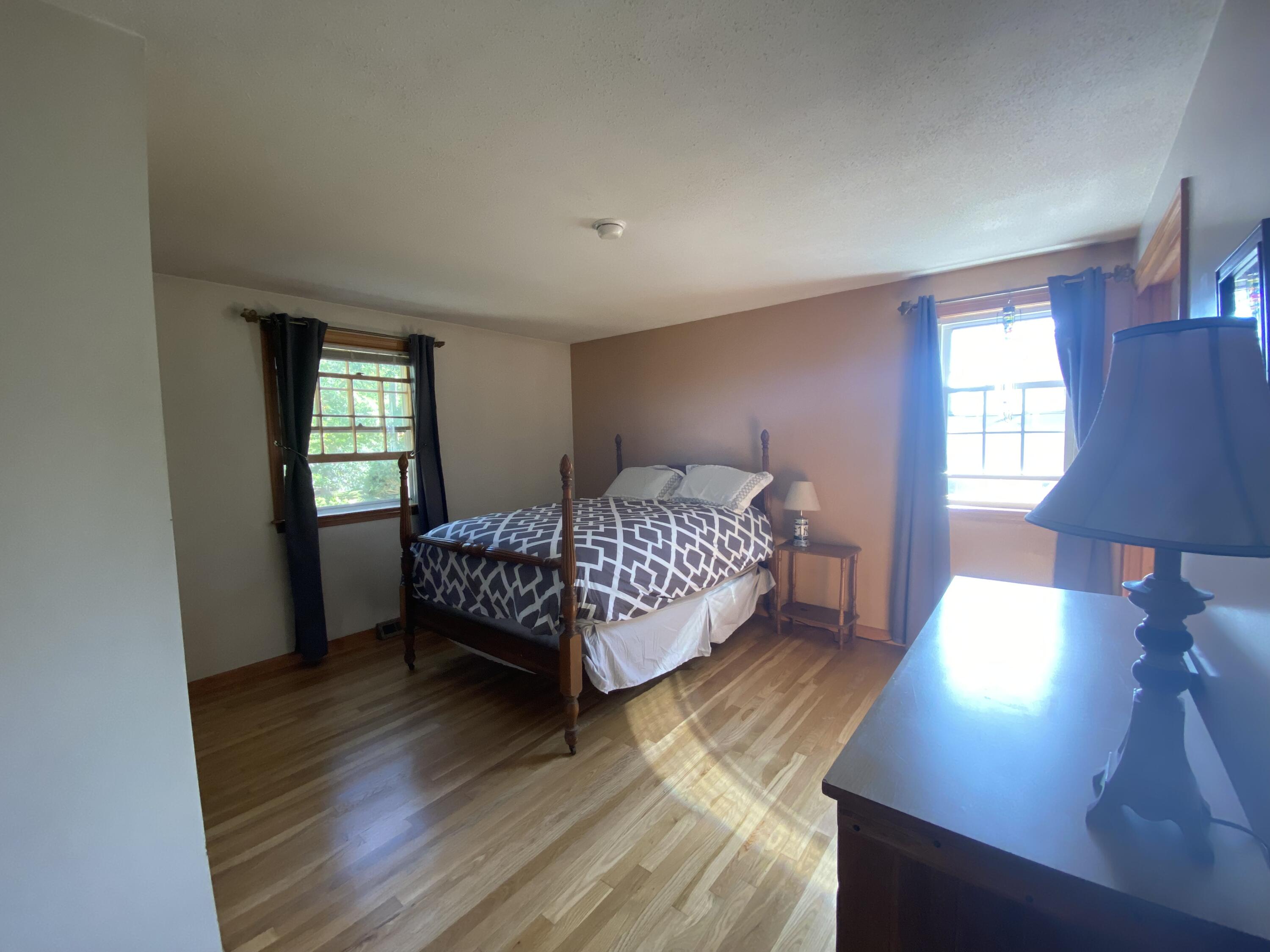 289 Megan Road Hyannis, MA 02601 - Photo 13 of 20 a bedroom with a bed window and a night stand