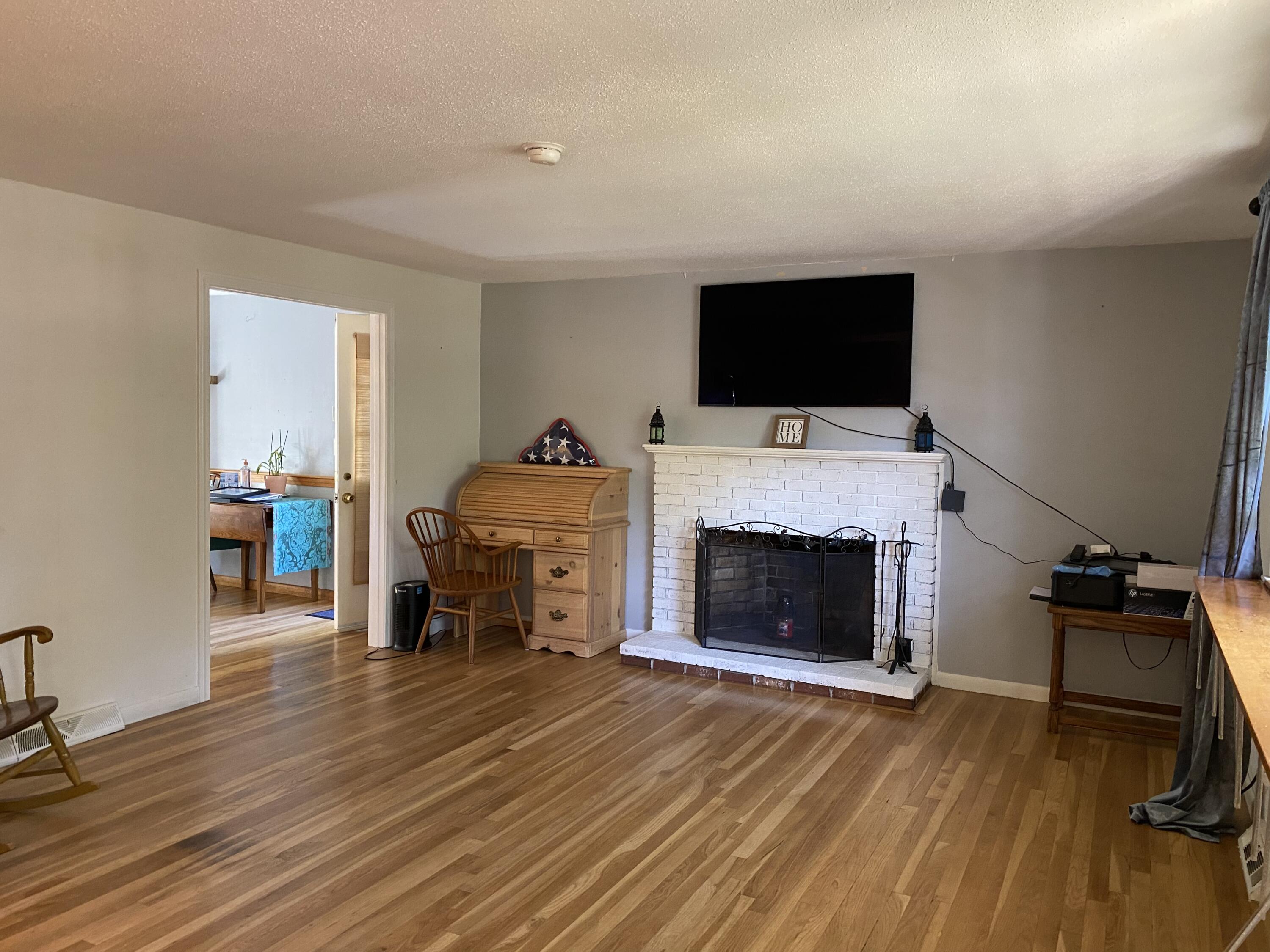 289 Megan Road Hyannis, MA 02601 - Photo 17 of 20 a living room with furniture and a fireplace