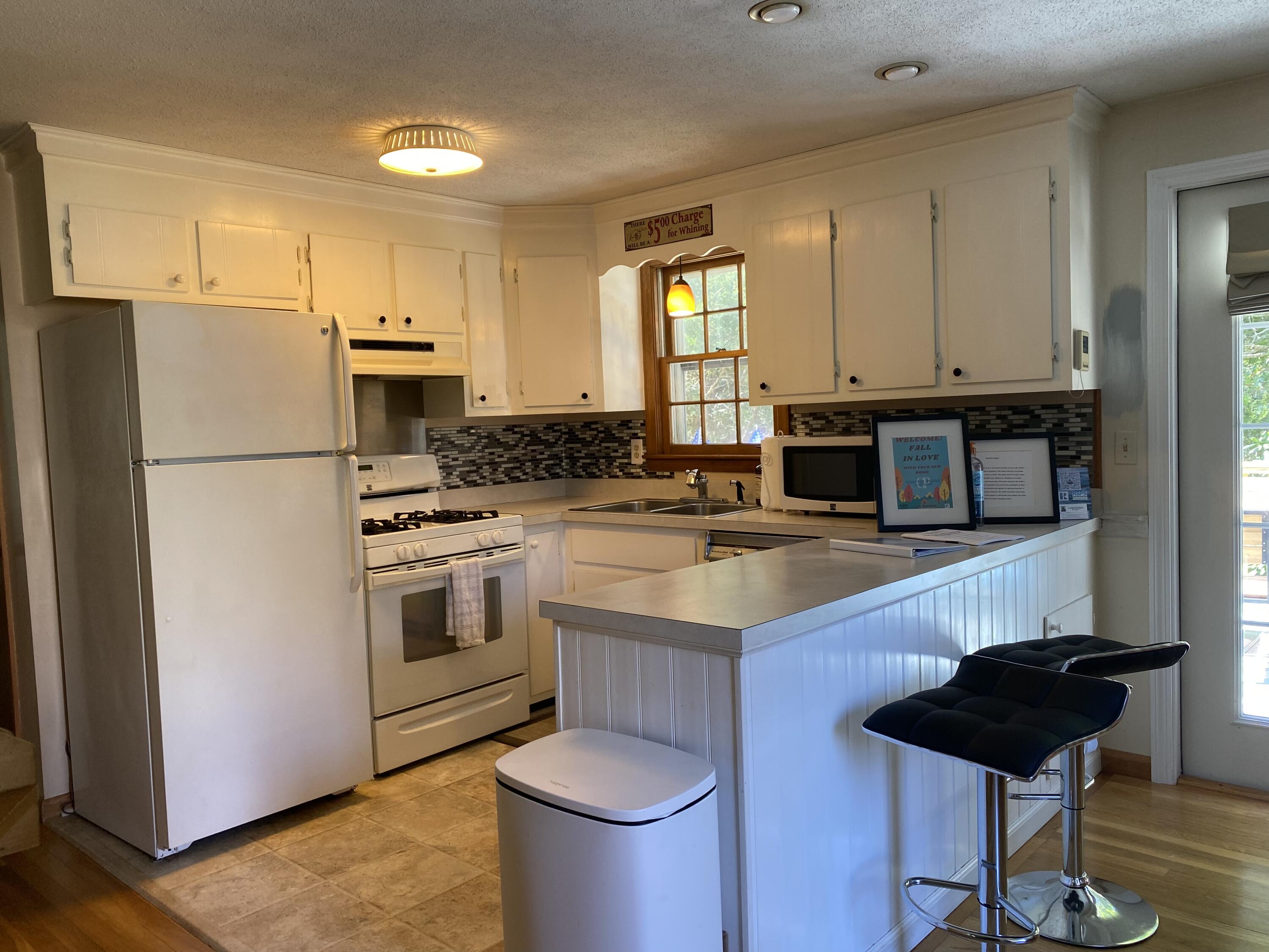 289 Megan Road Hyannis, MA 02601 - Photo 18 of 20 a kitchen with a sink a stove and refrigerator