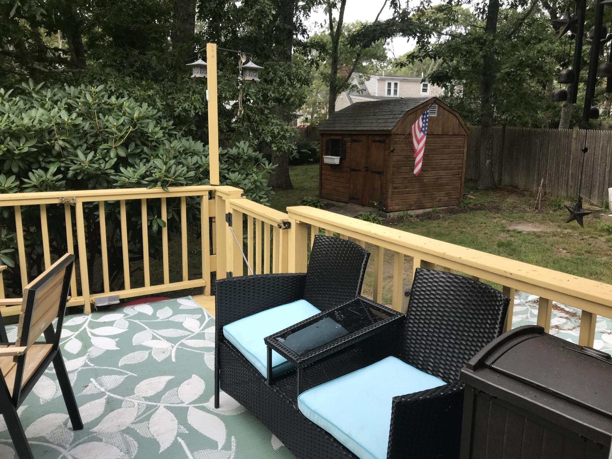 289 Megan Road Hyannis, MA 02601 - Photo 7 of 20 a view of a chairs and table in the balcony