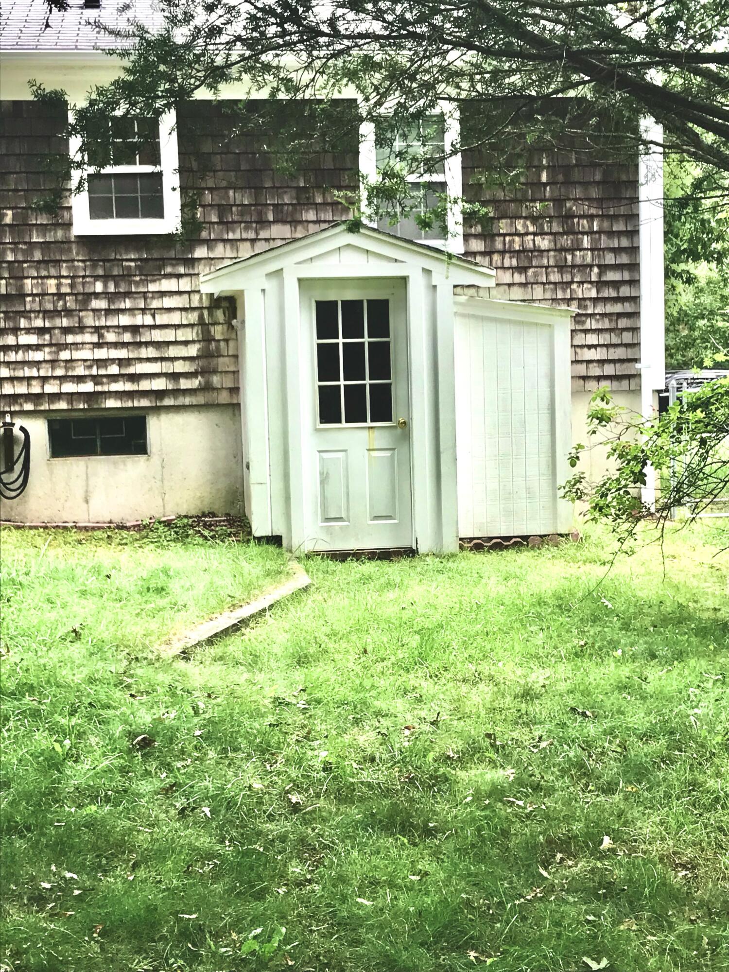 289 Megan Road Hyannis, MA 02601 - Photo 10 of 20 a front view of a house with a yard