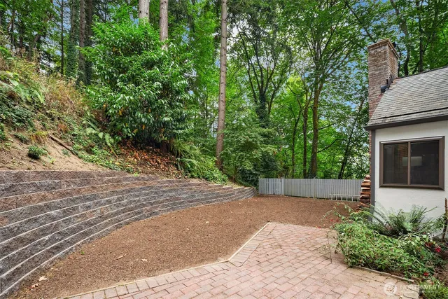 a view of house with trees in front of it