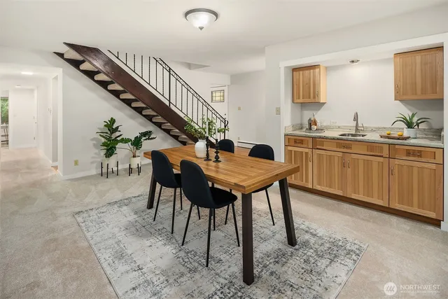 a dining room with furniture and window