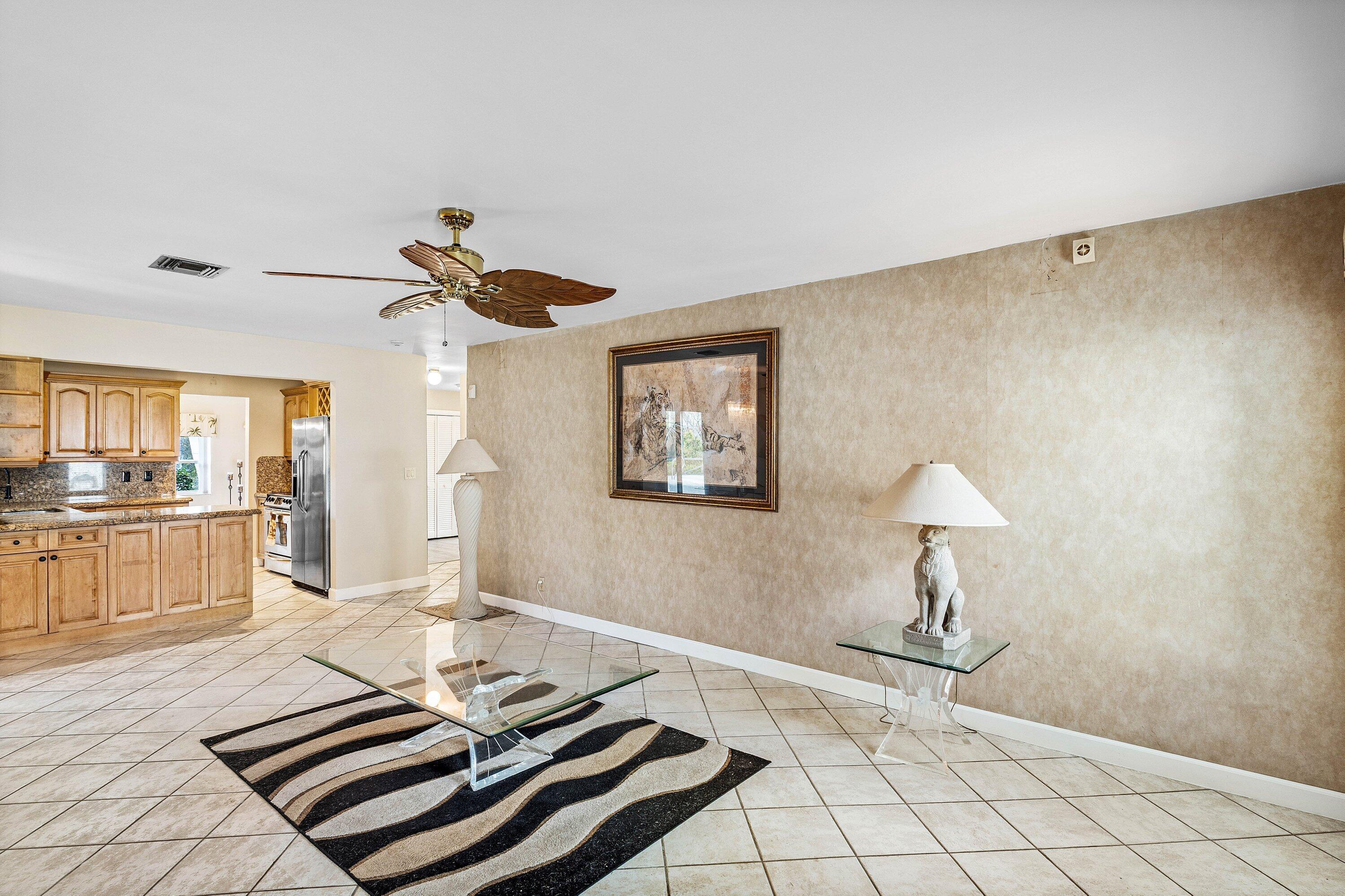 3068 Northwest 25th Way Boca Raton, FL 33434 - Photo 15 of 43 a living room with furniture and a table