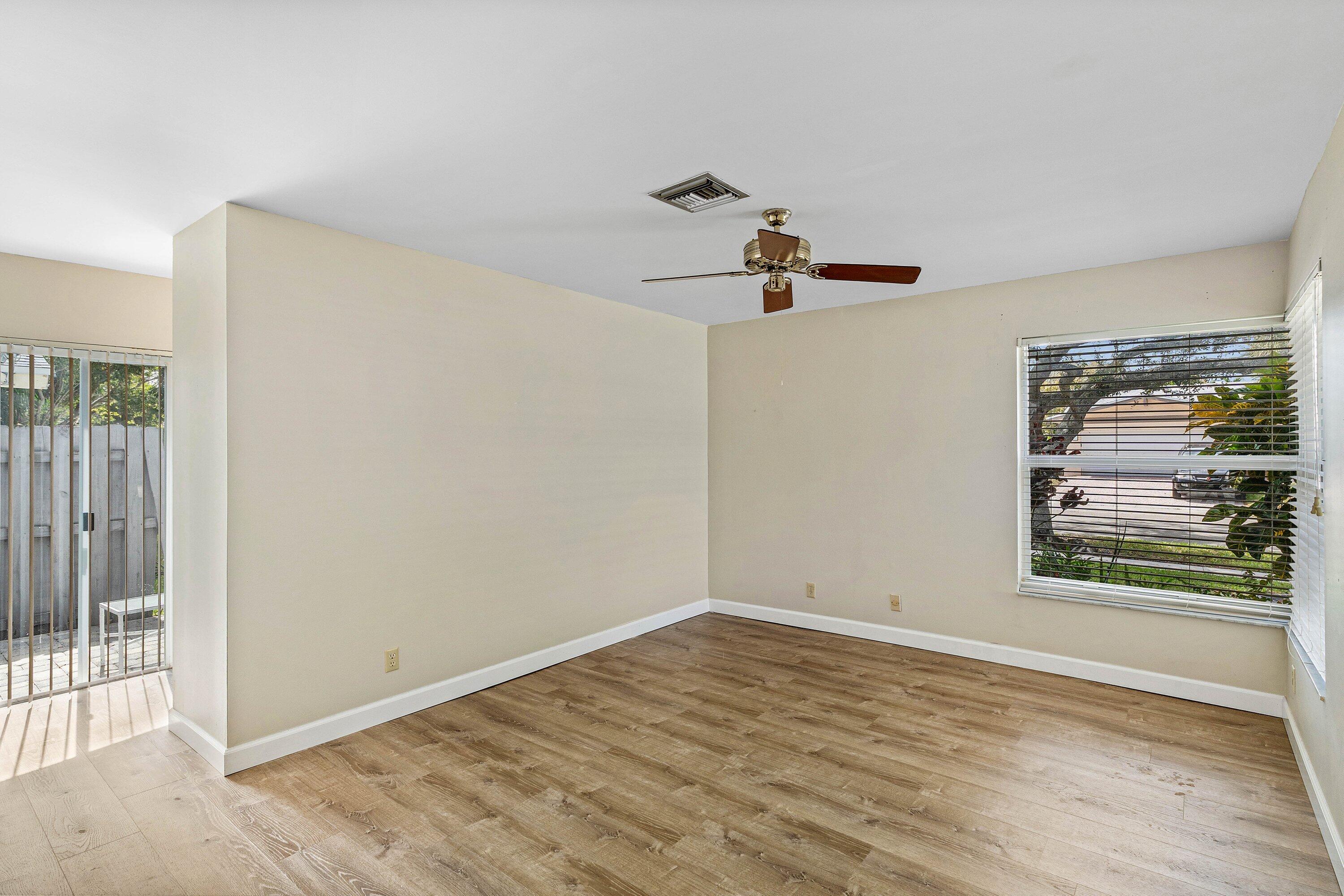 3068 Northwest 25th Way Boca Raton, FL 33434 - Photo 20 of 43 a view of a room with wooden floor and window