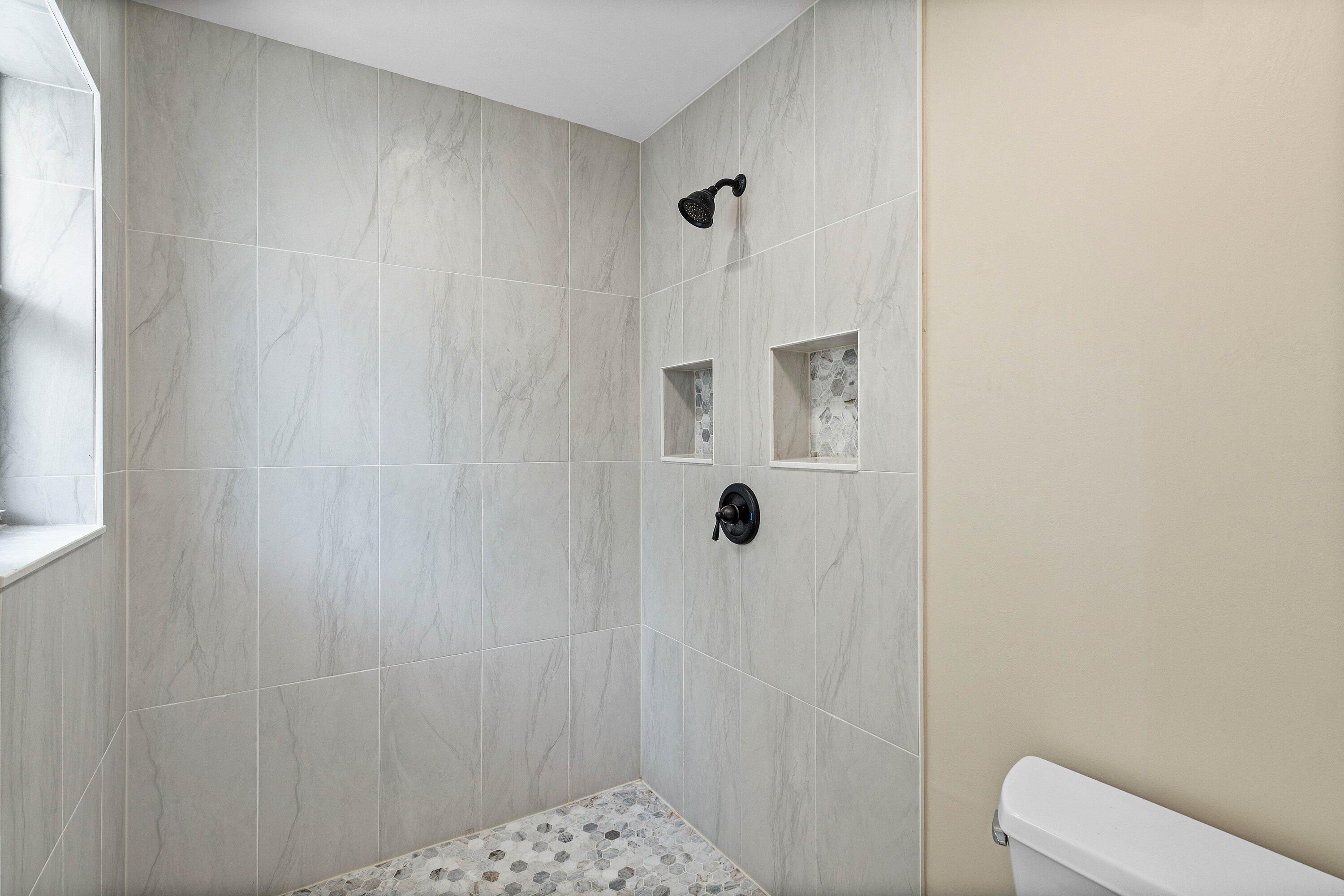 3068 Northwest 25th Way Boca Raton, FL 33434 - Photo 23 of 43 a bathroom with a shower and toilet