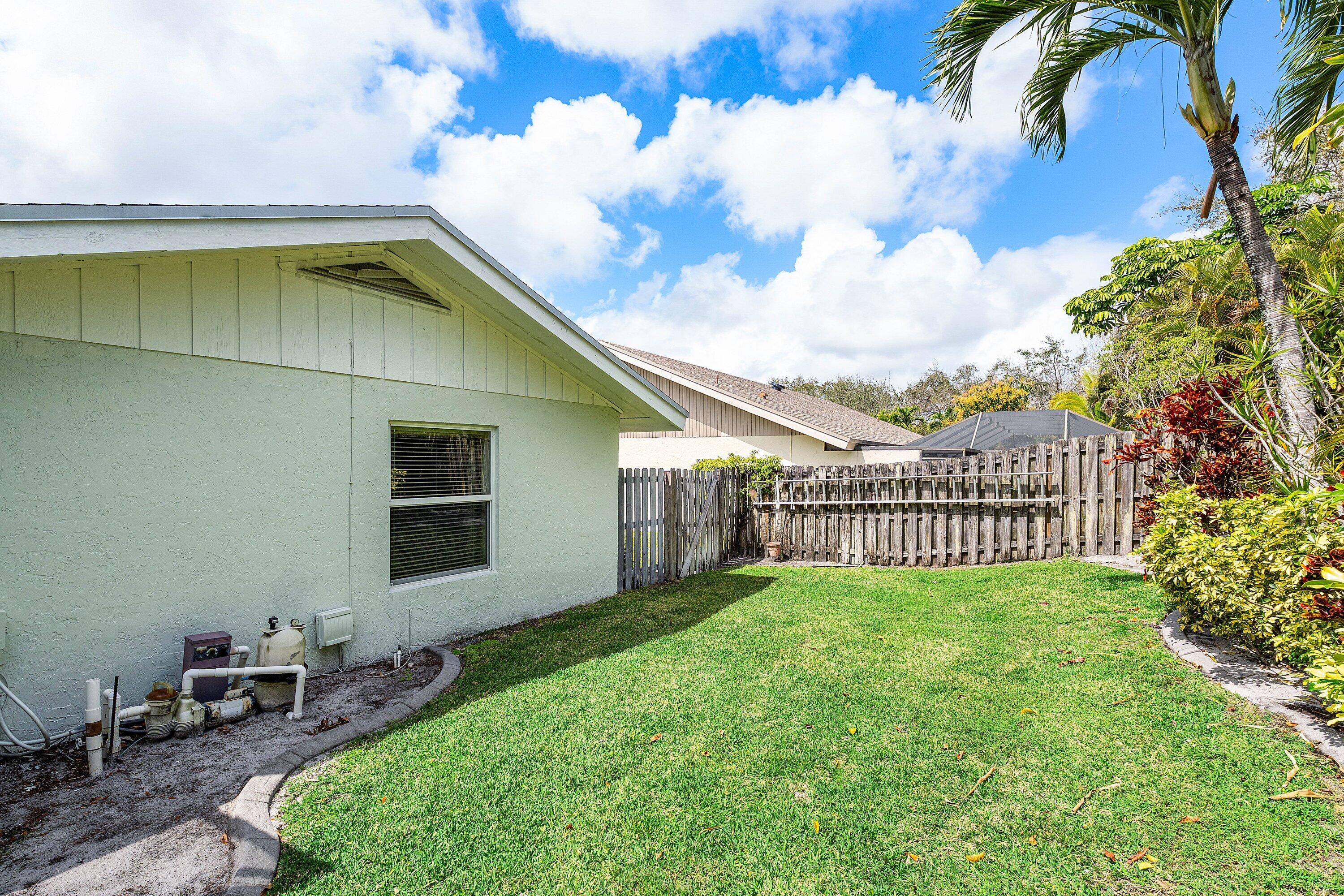 3068 Northwest 25th Way Boca Raton, FL 33434 - Photo 26 of 43 a view of a backyard with plants