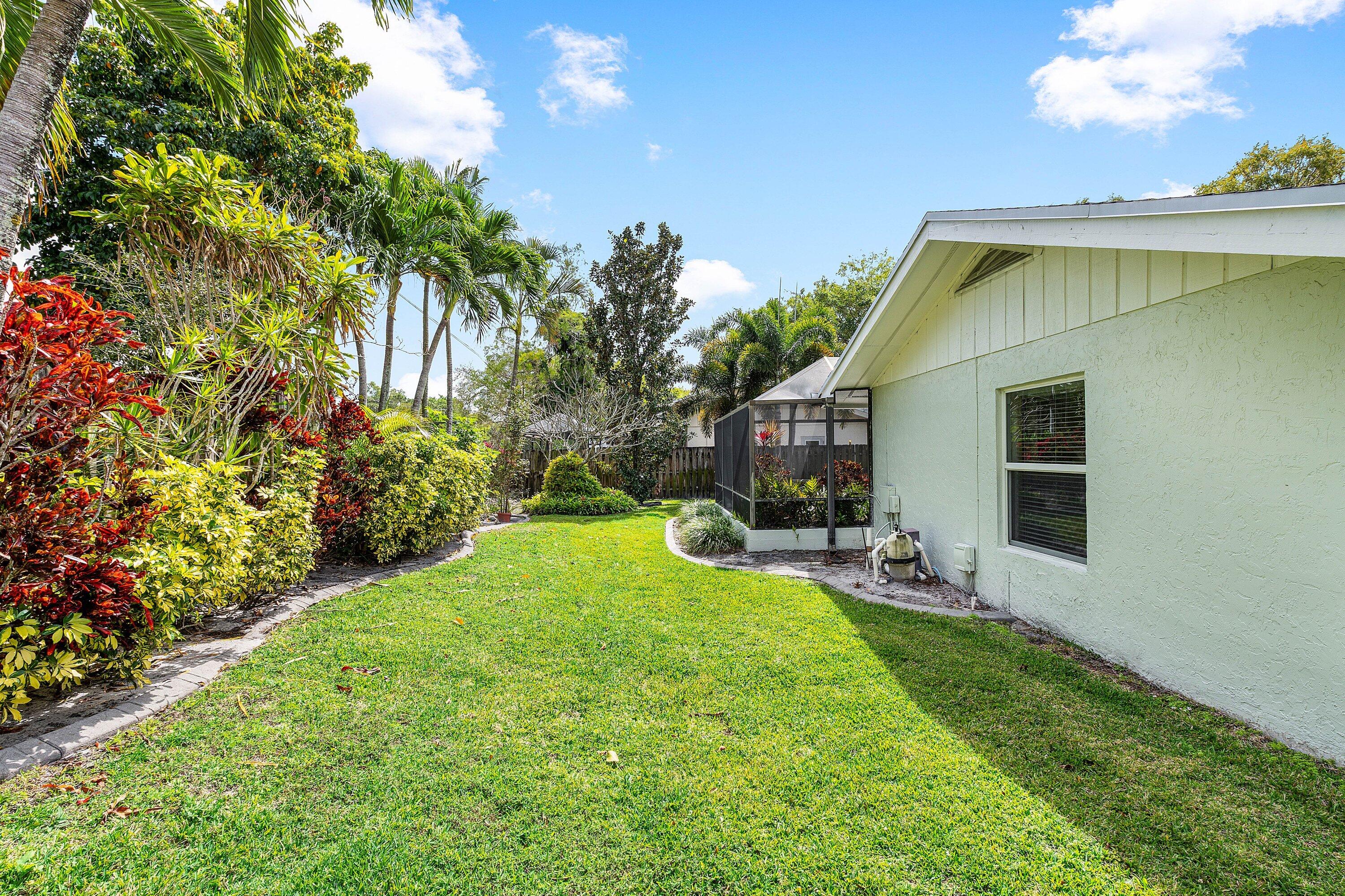 3068 Northwest 25th Way Boca Raton, FL 33434 - Photo 27 of 43 a view of backyard with a garden and entertaining space