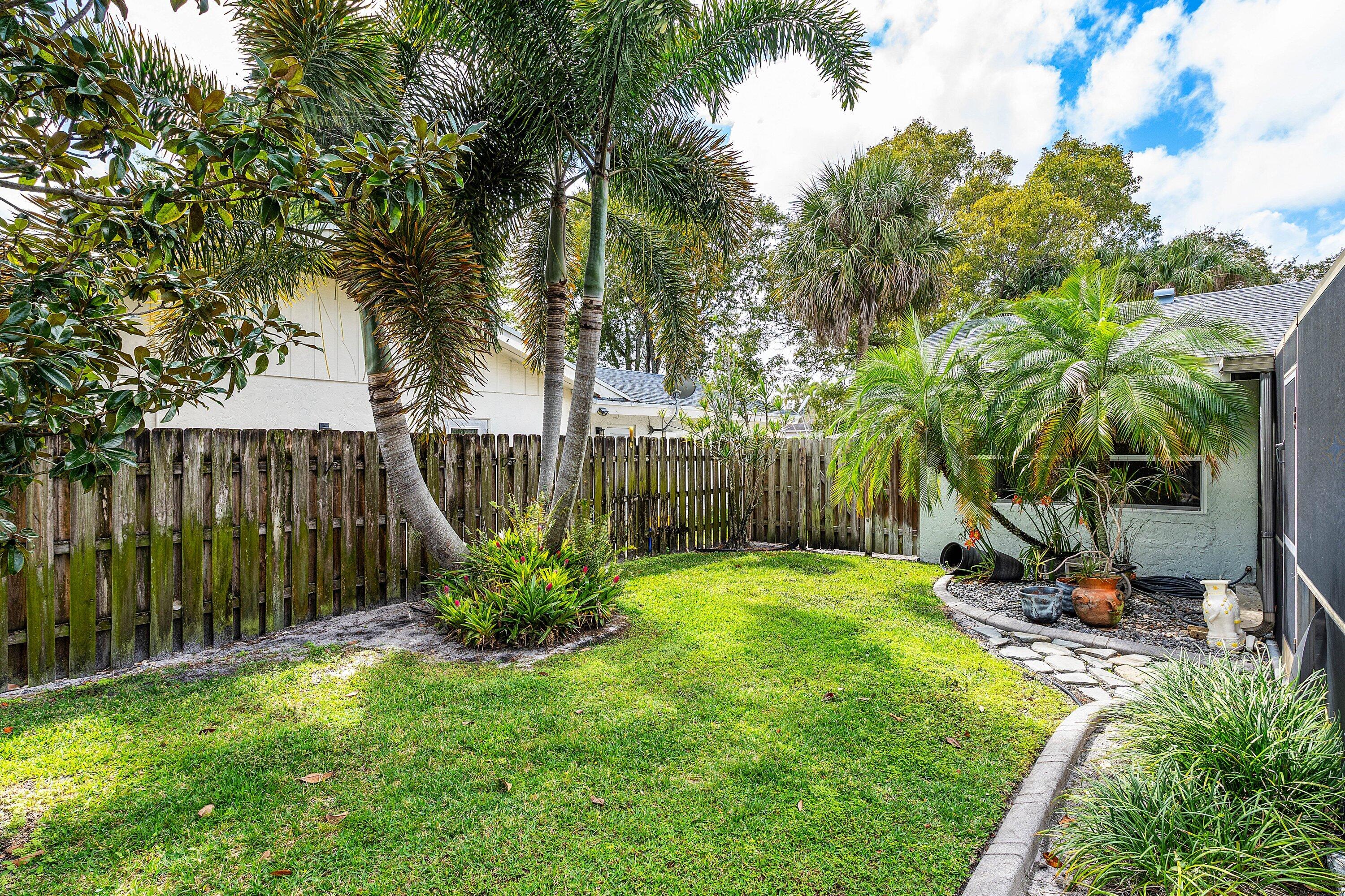 3068 Northwest 25th Way Boca Raton, FL 33434 - Photo 29 of 43 a view of a garden with a slide