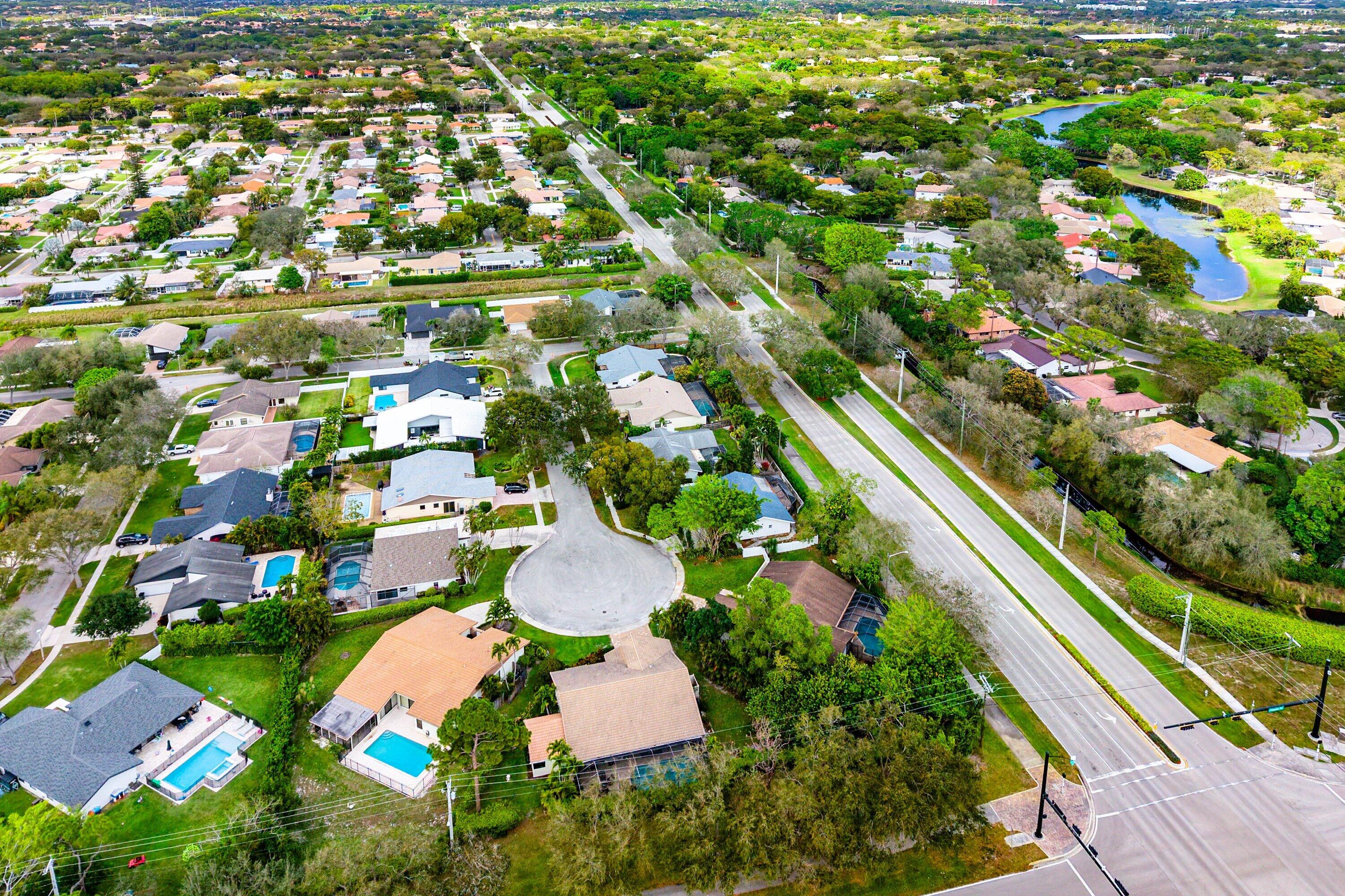3068 Northwest 25th Way Boca Raton, FL 33434 - Photo 31 of 43 an aerial view of residential houses with outdoor space