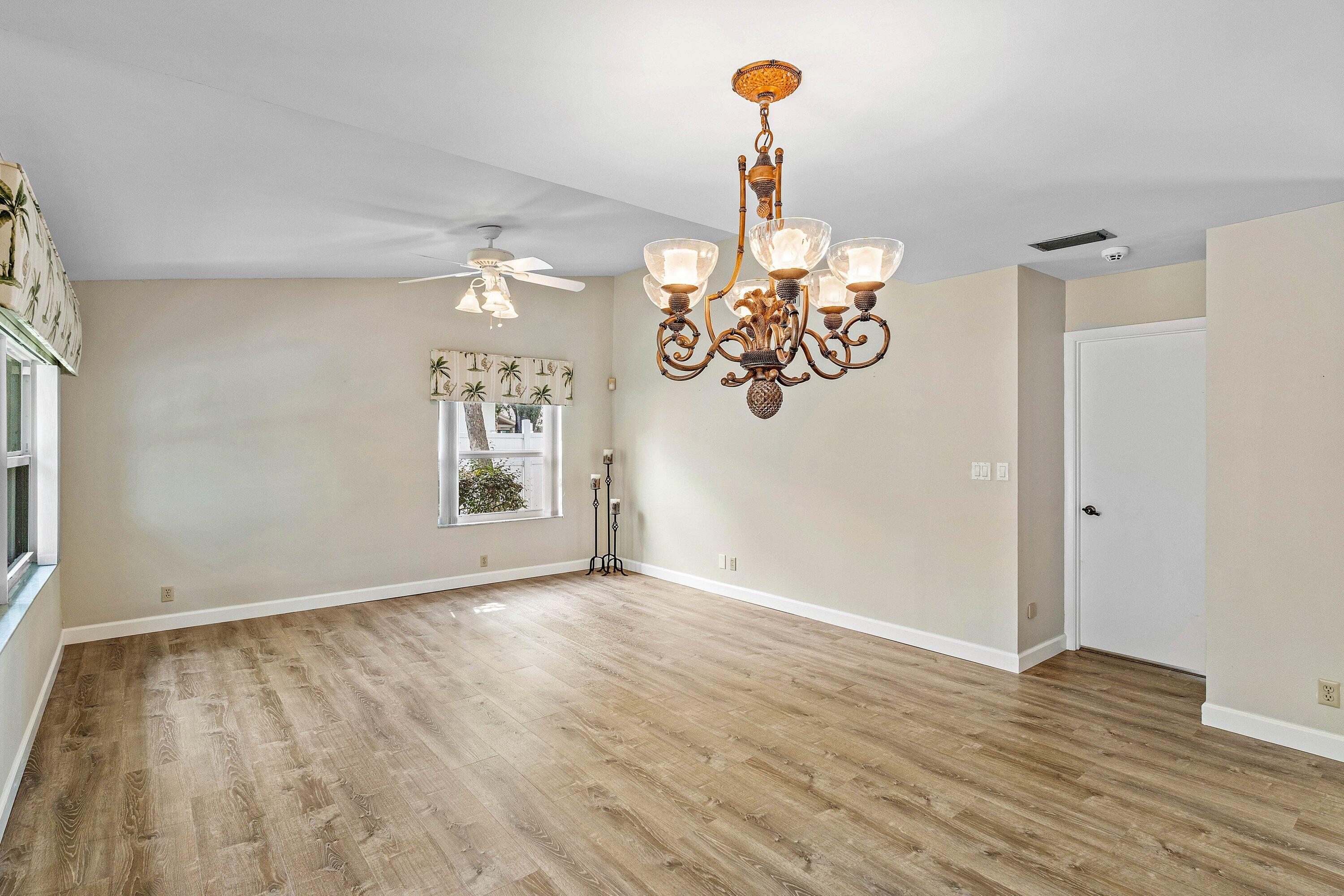 3068 Northwest 25th Way Boca Raton, FL 33434 - Photo 6 of 43 a view of an empty room and wooden floor