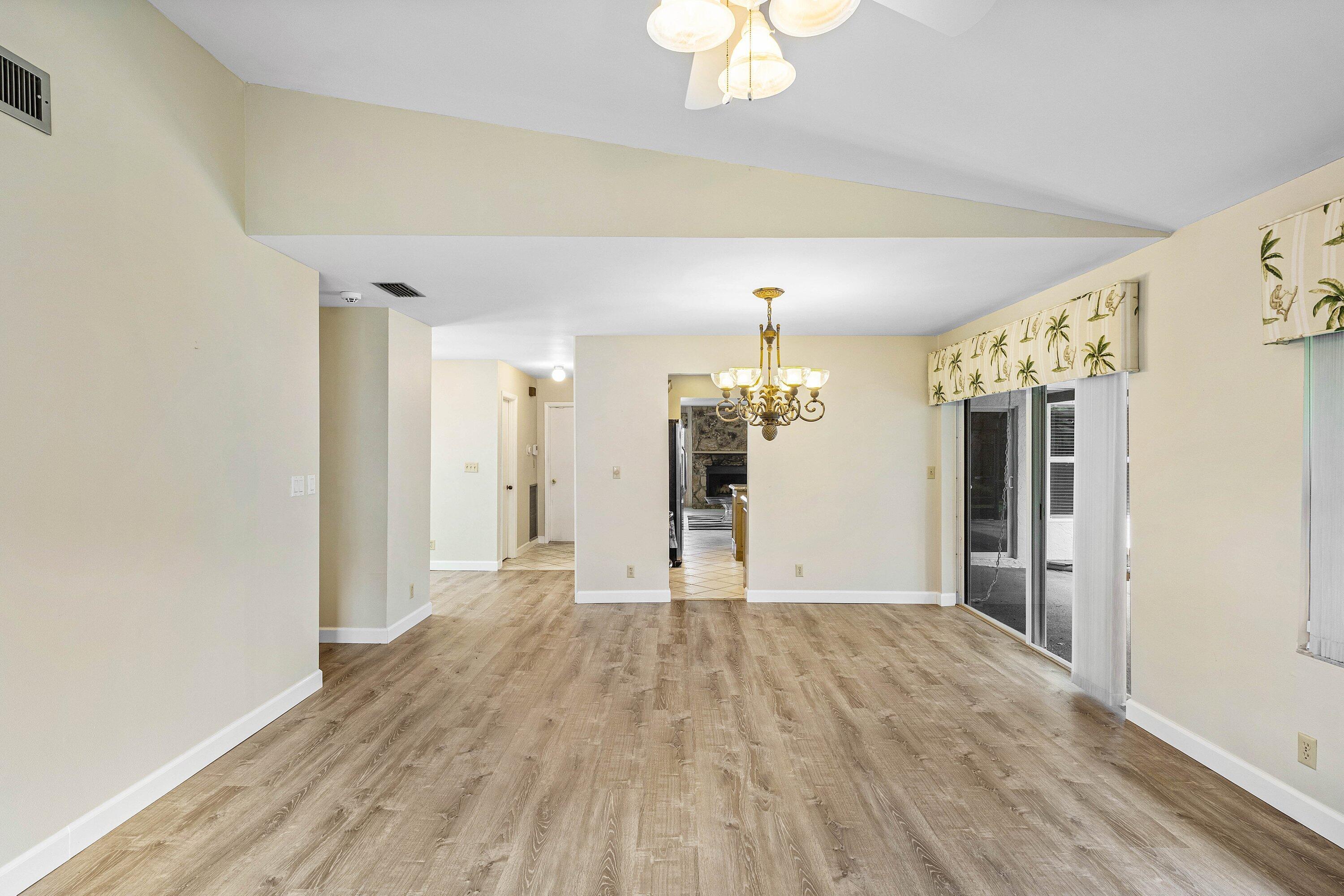 3068 Northwest 25th Way Boca Raton, FL 33434 - Photo 8 of 43 a view of empty room with wooden floor