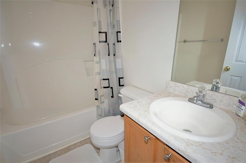 5799 Cedar Croft Lane Lithonia, GA 30058 - Photo 11 of 16 a bathroom with a granite countertop sink a toilet and shower