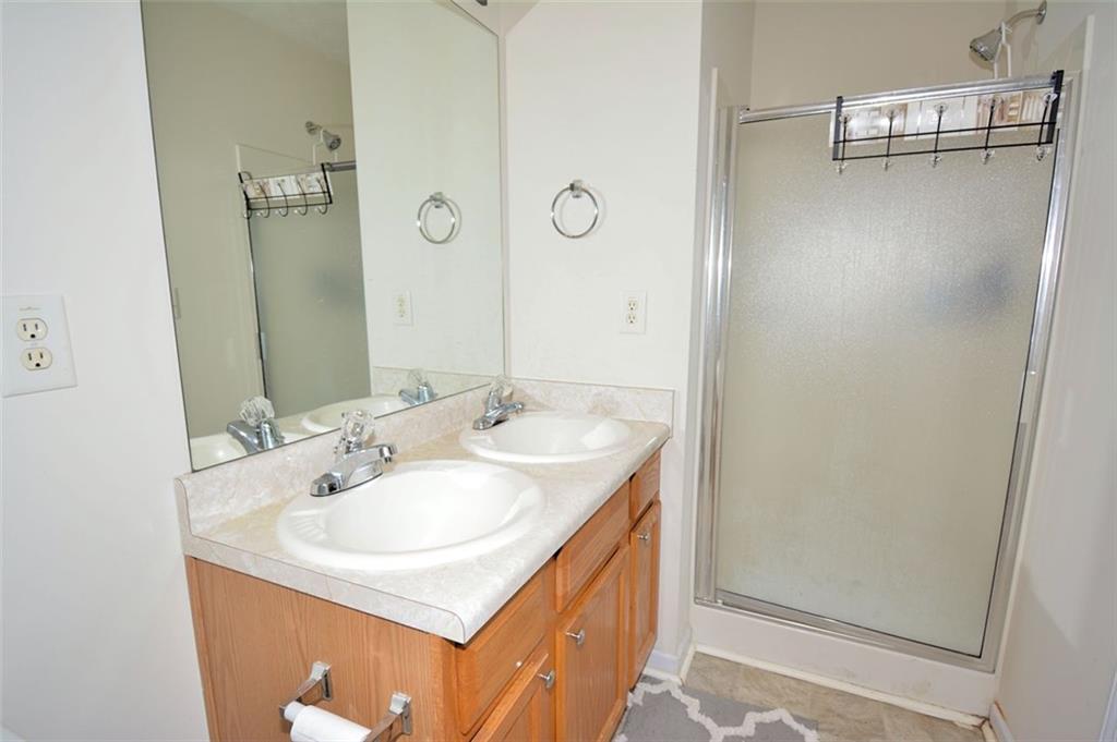 5799 Cedar Croft Lane Lithonia, GA 30058 - Photo 12 of 16 a bathroom with a sink and a mirror