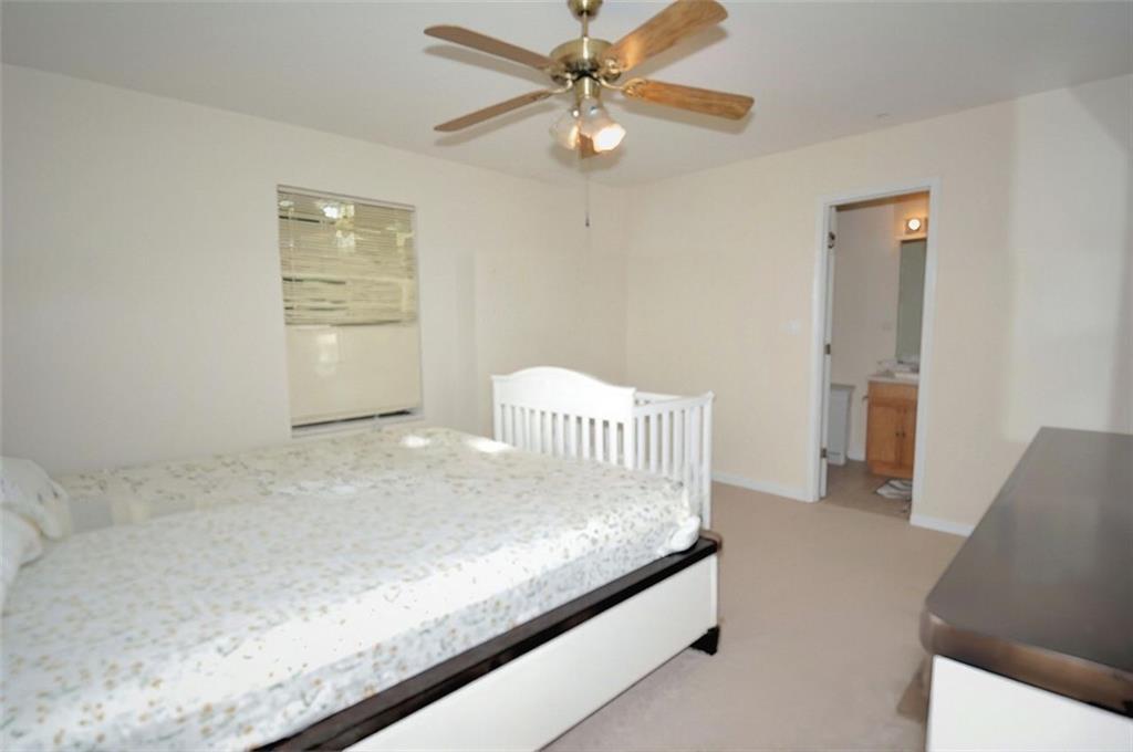 5799 Cedar Croft Lane Lithonia, GA 30058 - Photo 15 of 16 a view of livingroom with hardwood floor and a ceiling fan