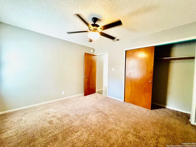 a view of a livingroom with a ceiling fan and a ceiling fan