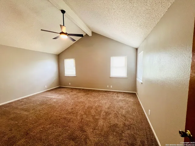 a view of empty room with windows