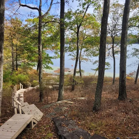a view of a backyard of the house