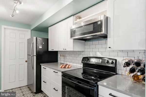 a kitchen with a stove and a microwave