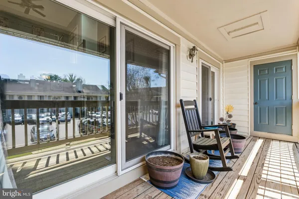 a view of a balcony with chair and table
