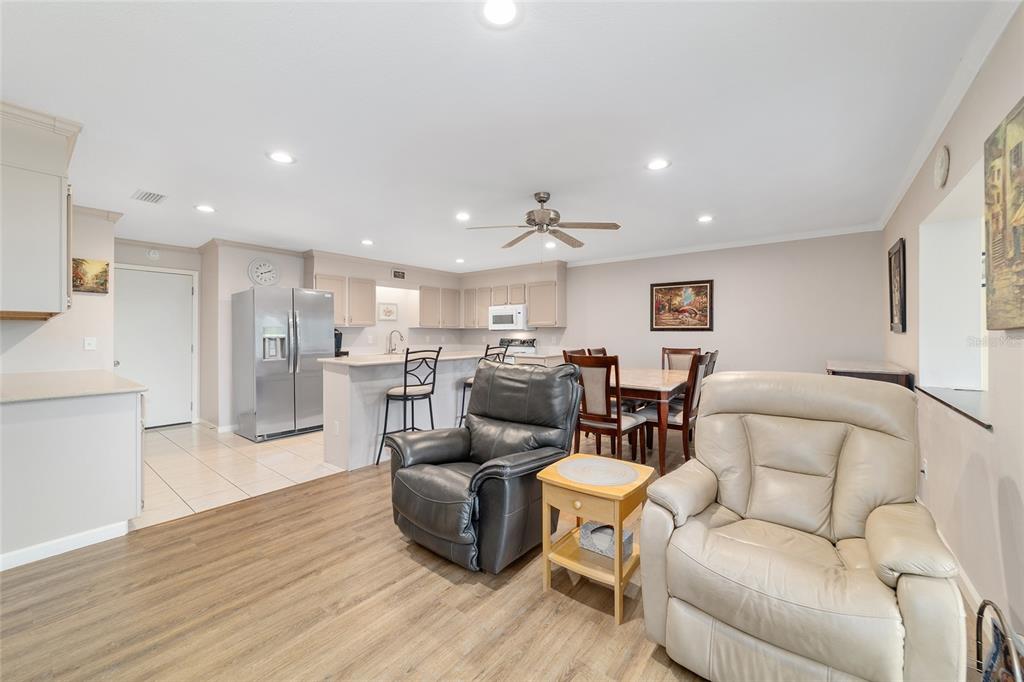 9240 Southwest 90th Court, Unit B Ocala, FL 34481 - Photo 15 of 40 a living room with furniture and a wooden floor
