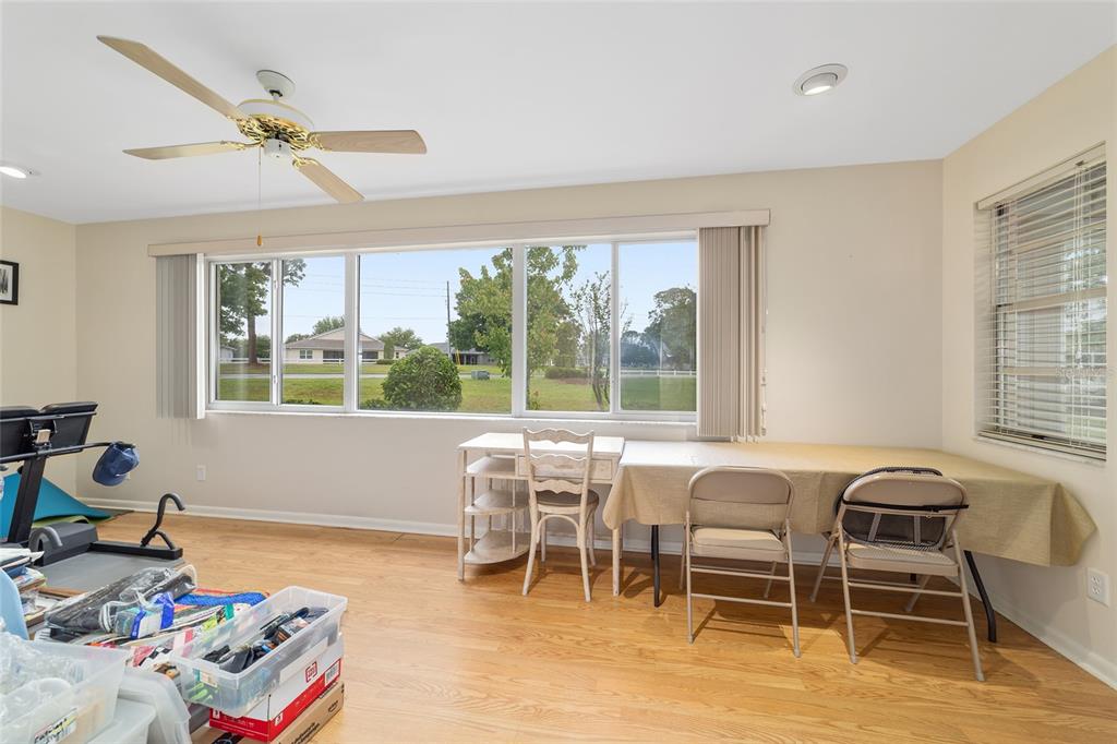 9240 Southwest 90th Court, Unit B Ocala, FL 34481 - Photo 23 of 40 a dining room with wooden floor and a window