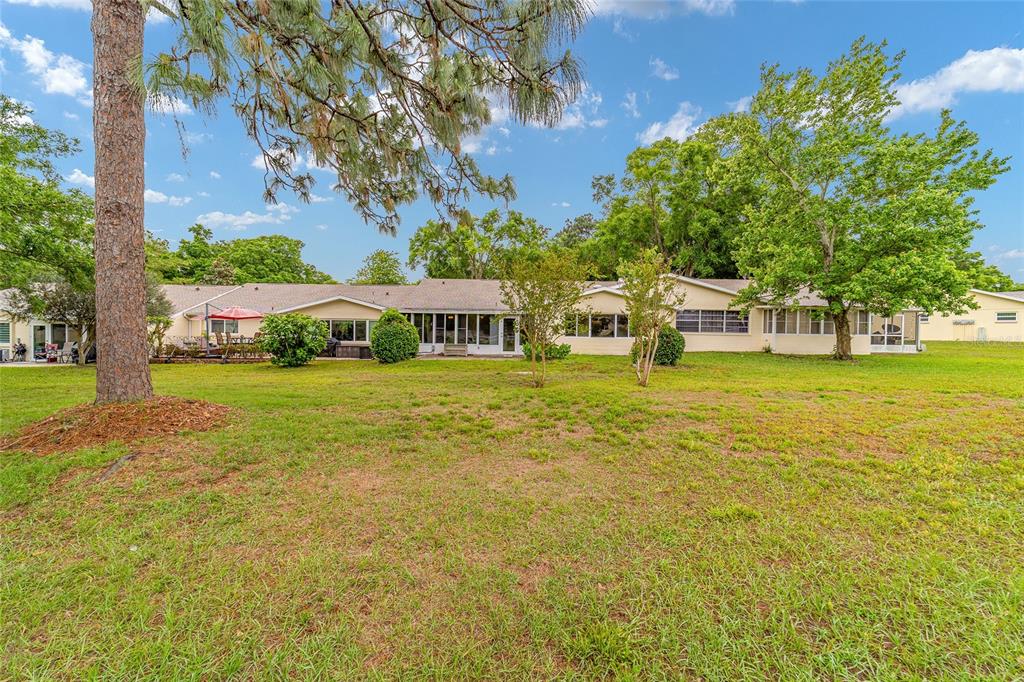 9240 Southwest 90th Court, Unit B Ocala, FL 34481 - Photo 3 of 40 a view of swimming pool with outdoor seating and yard