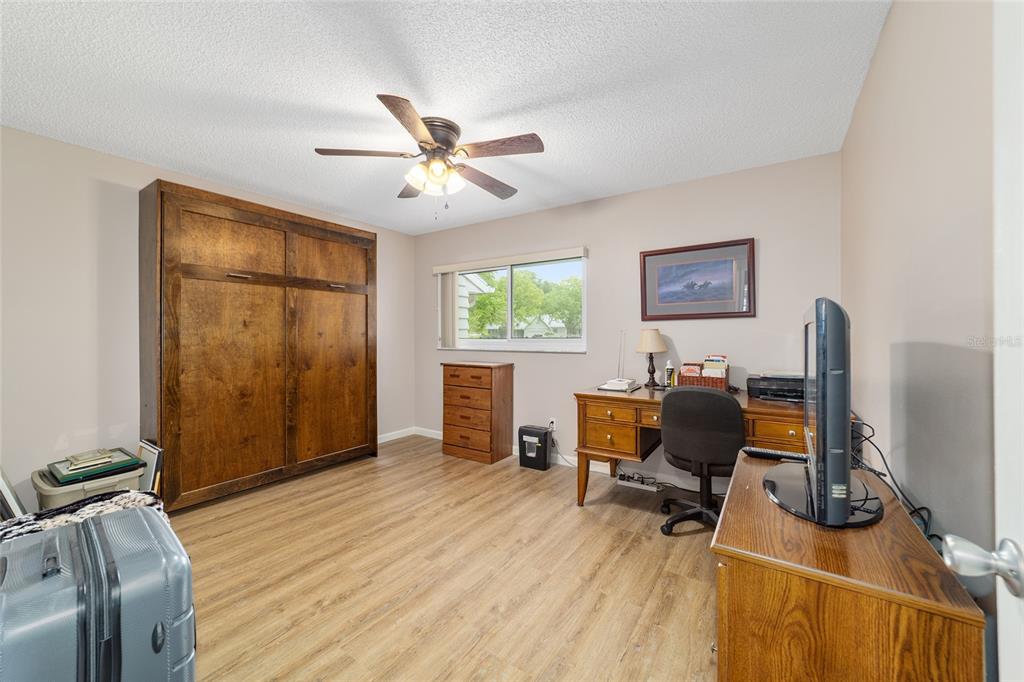 9240 Southwest 90th Court, Unit B Ocala, FL 34481 - Photo 33 of 40 a view of a workspace with furniture and a window