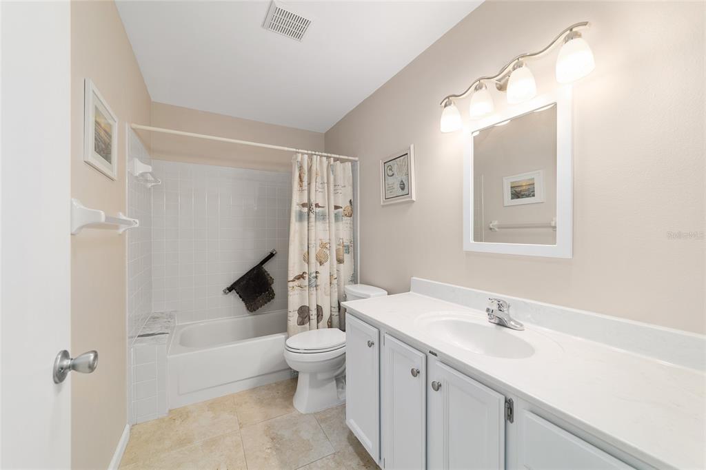 9240 Southwest 90th Court, Unit B Ocala, FL 34481 - Photo 35 of 40 a bathroom with a toilet sink and mirror