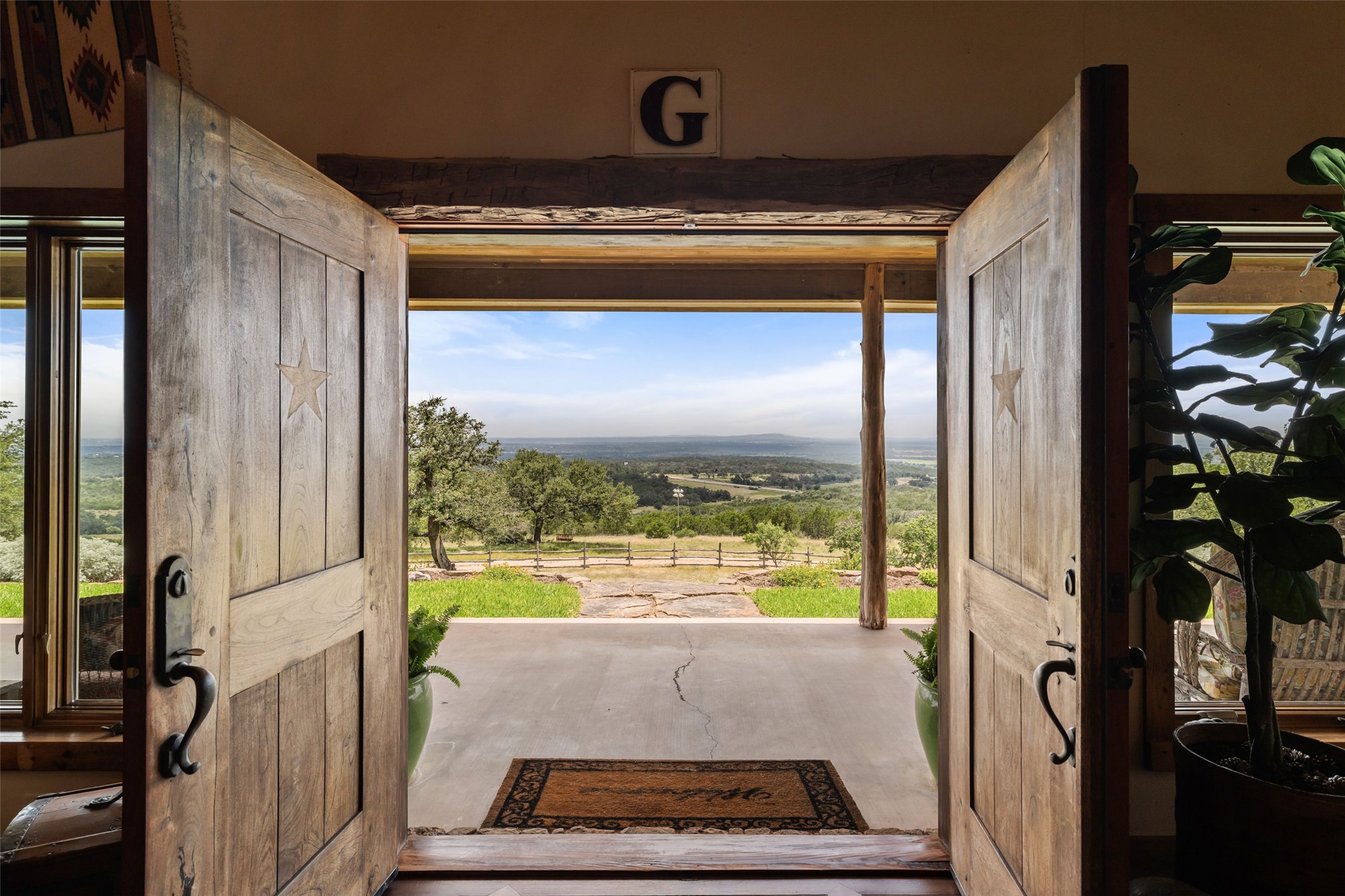 8400 Ranch Road 1431 Marble Falls, TX 78654 - Photo 2 of 30 Step through a grand entry to behold commanding views of the sprawling landscape beyond.