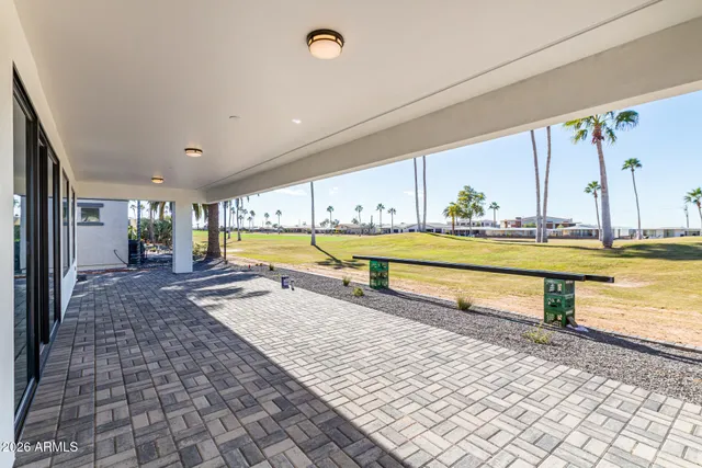 a view of swimming pool with a table and chairs