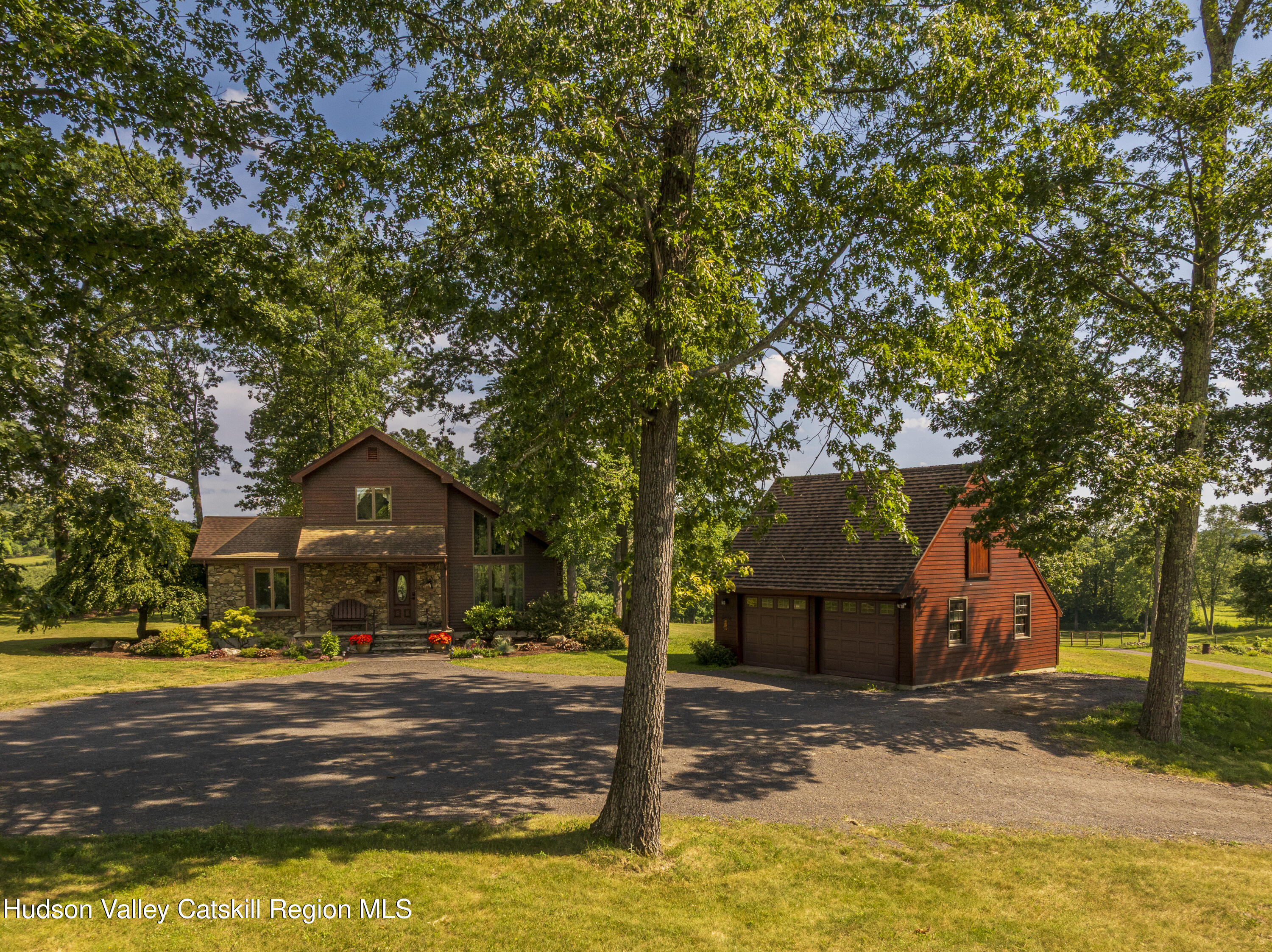 48 County Rte 14 Hudson, NY 12534 - Photo 22 of 42 a front view of a house with a yard and large tree
