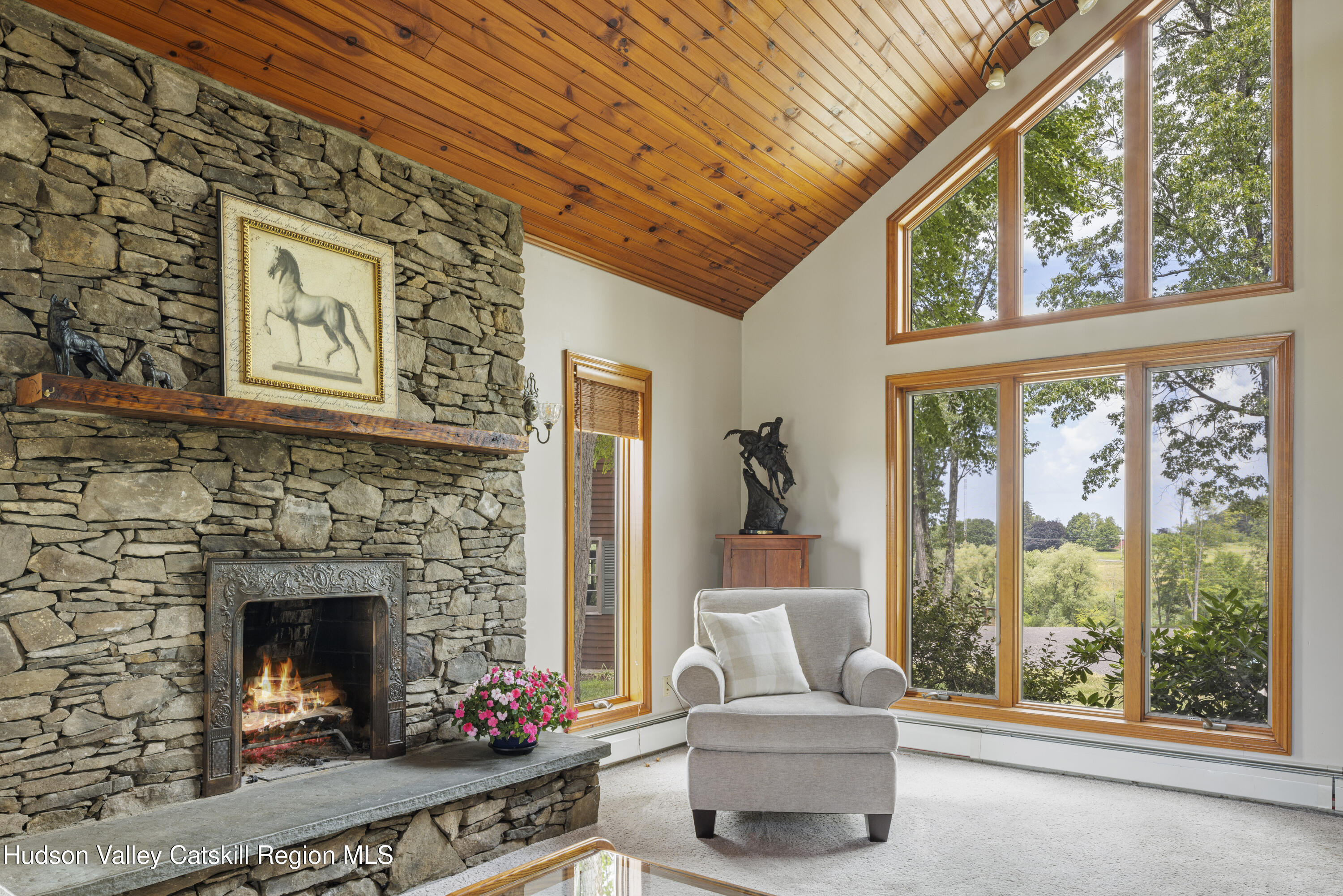 48 County Rte 14 Hudson, NY 12534 - Photo 3 of 42 a living room with furniture a fireplace and a large window