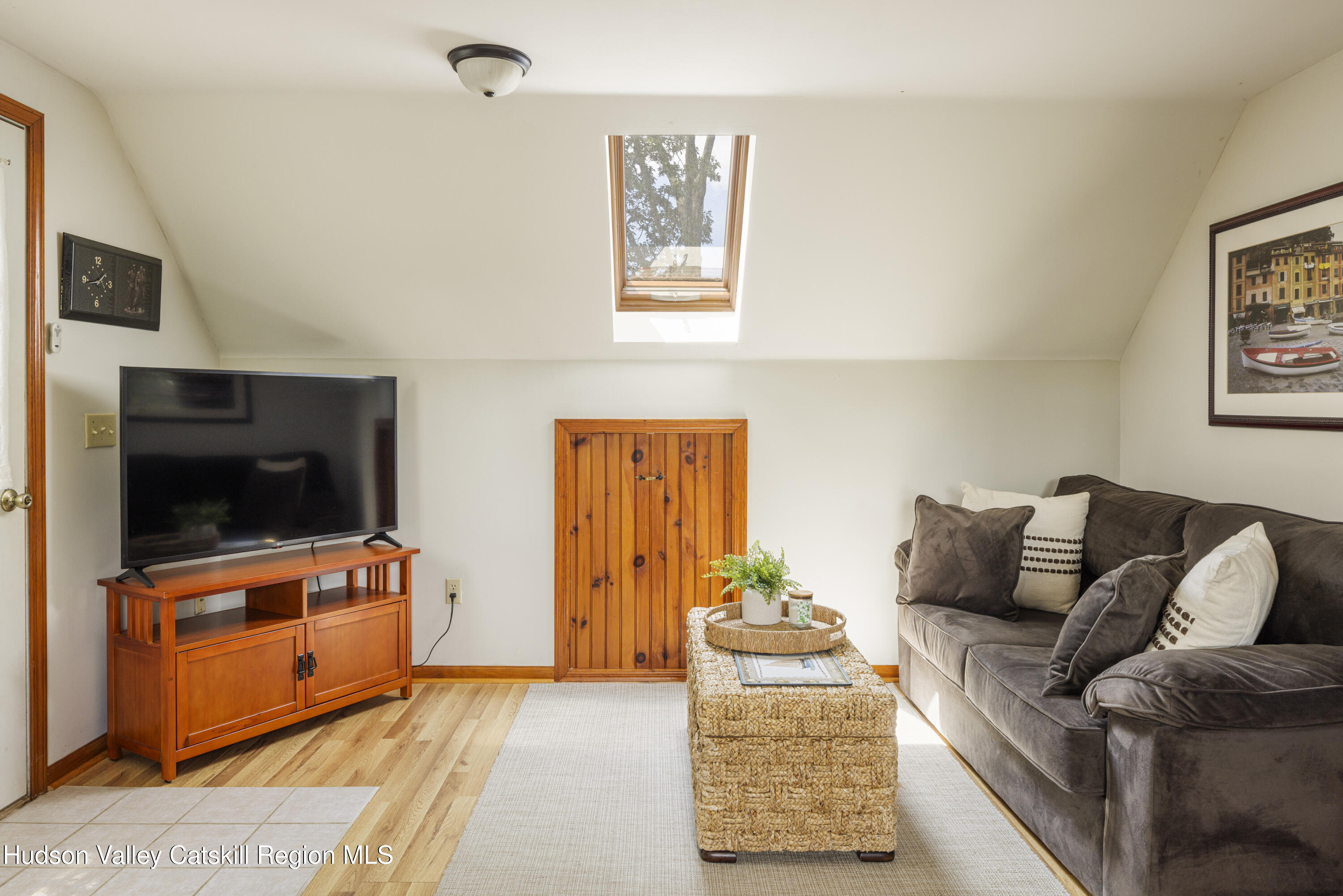 48 County Rte 14 Hudson, NY 12534 - Photo 33 of 42 a living room with furniture and a flat screen tv