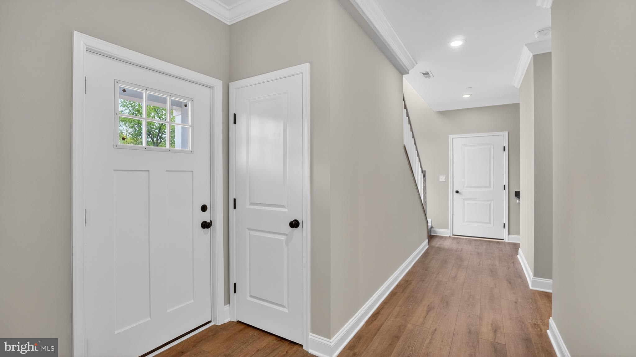 2001 Poplar Ridge Road Pasadena, MD 21122 - Photo 22 of 83 a view of a hallway with wooden floor and staircase