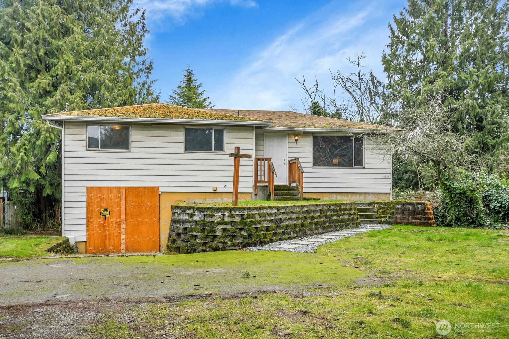11428 18th Place Southwest Burien, WA 98146 - Photo 1 of 1 a front view of a house with a garden