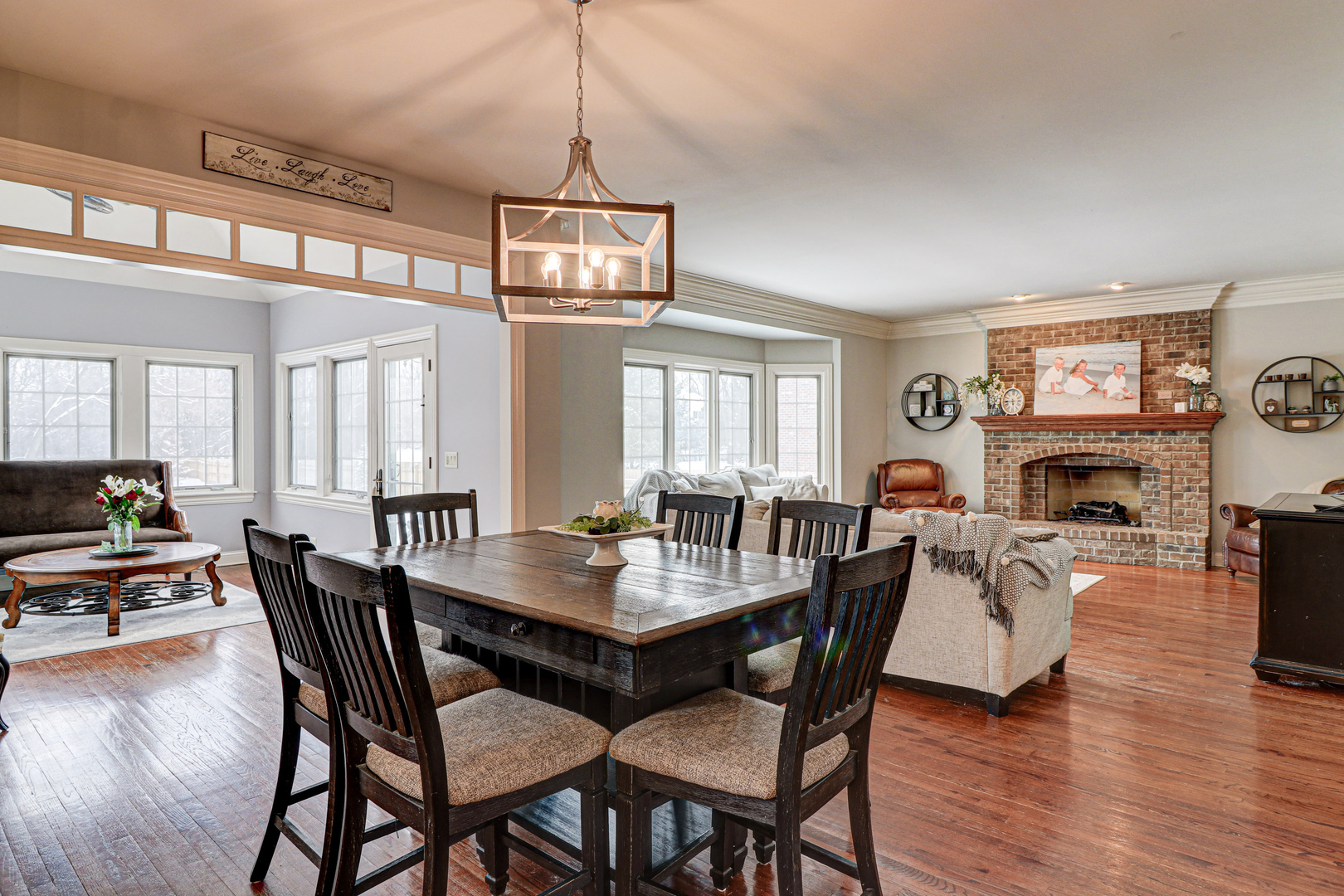 N491 Peter Road Winfield, IL 60190 - Photo 20 of 46 a view of a dining room with furniture a chandelier and wooden floor