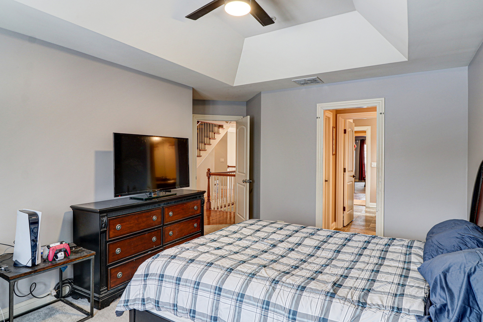 N491 Peter Road Winfield, IL 60190 - Photo 27 of 46 a bedroom with a bed and a flat screen tv