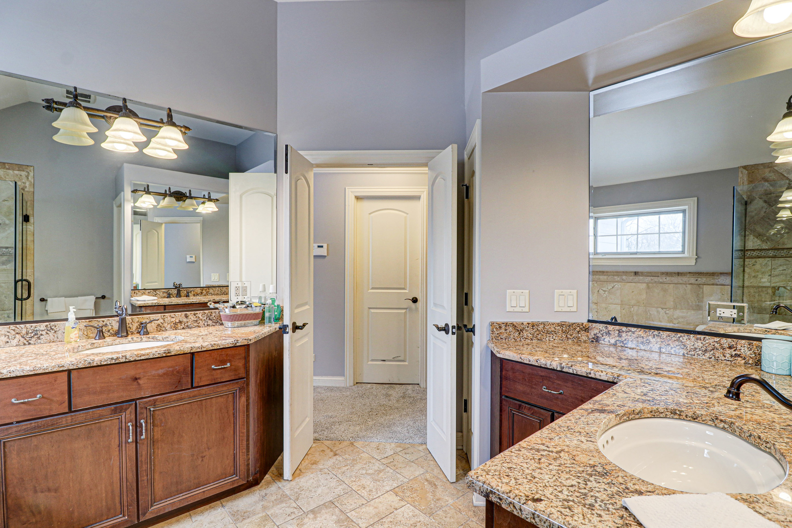 N491 Peter Road Winfield, IL 60190 - Photo 29 of 46 a bathroom with a granite countertop sink double vanity and a mirror