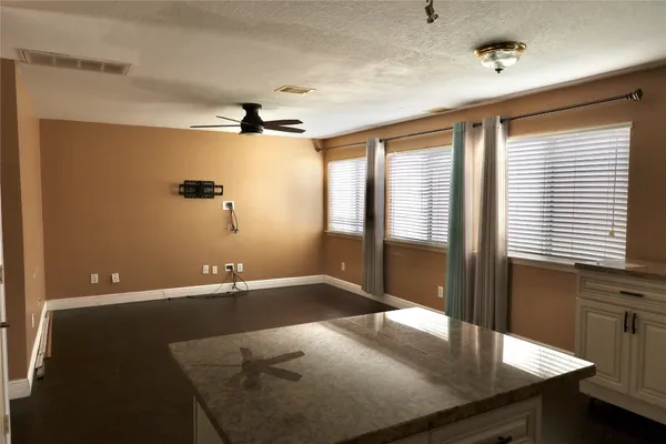a view of a livingroom with furniture and window