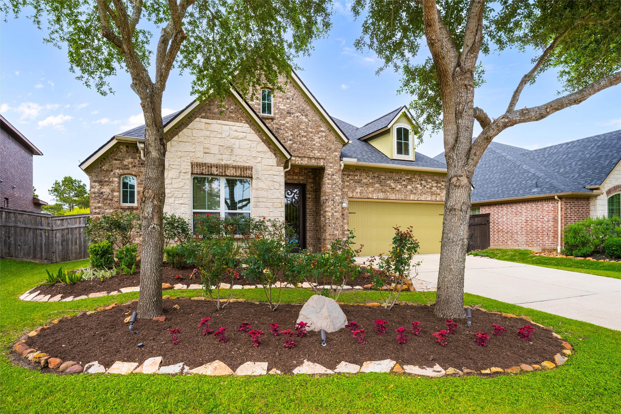 27714 Linden Ridge Lane Fulshear, TX 77441 - Photo 12 of 48 Freshly updated landscaping and a new roof (2025), and uplighting, give A+ curb appeal
