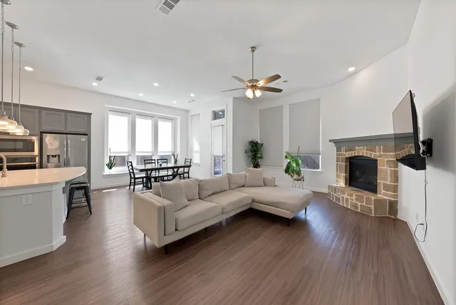 a living room with furniture and a fireplace