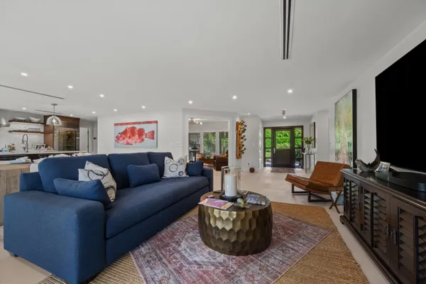 a kitchen with stainless steel appliances granite countertop a refrigerator and a stove