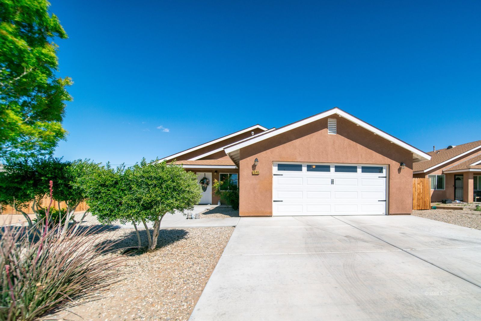 1540 Mayo Street Ridgecrest, CA 93555 - Photo 2 of 32 a front view of a house with a yard