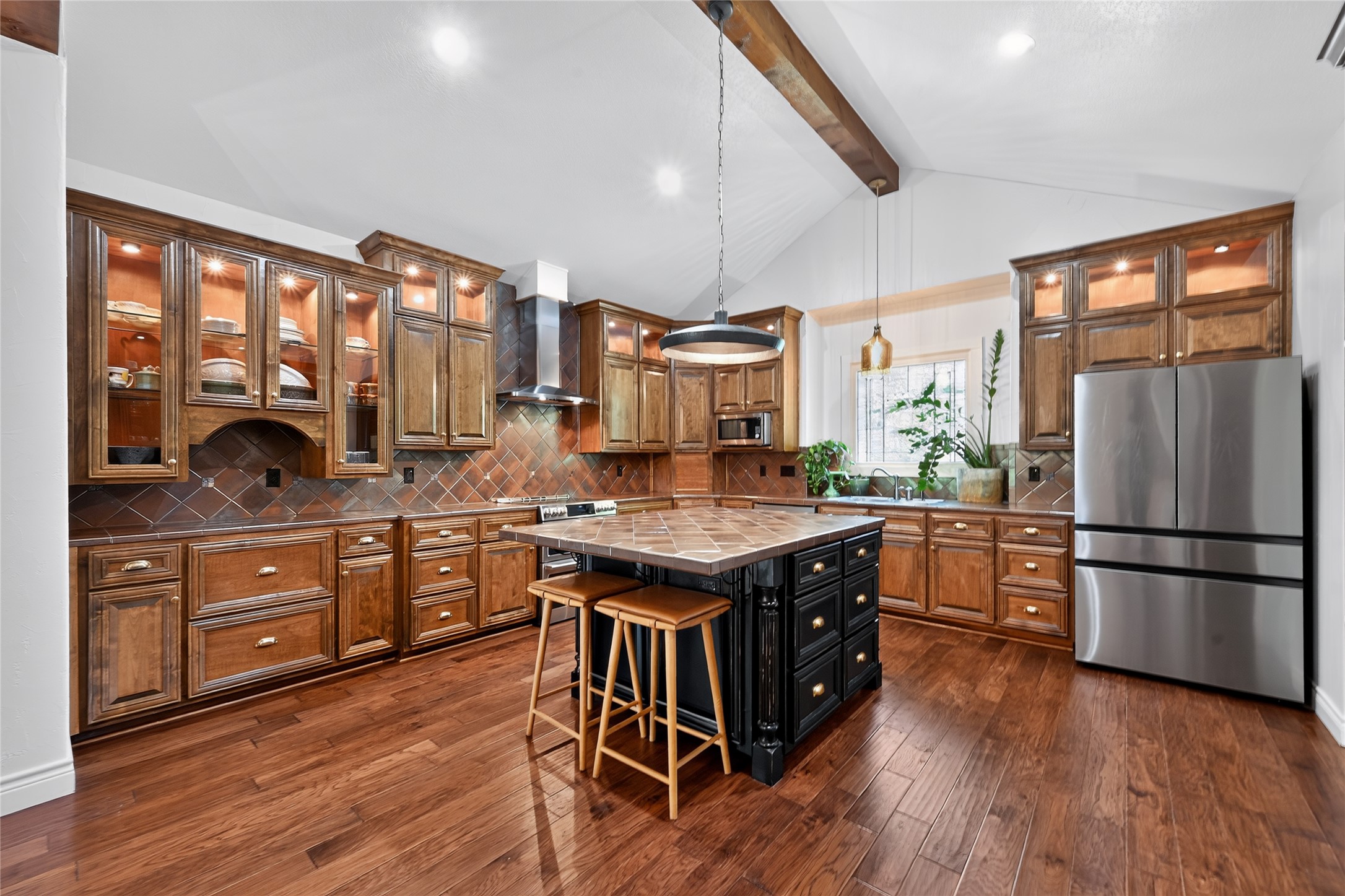 700 Willow Creek Road Salado, TX 76571 - Photo 17 of 39 Kitchen with custom cabinets, glass fronts and lighted displays.