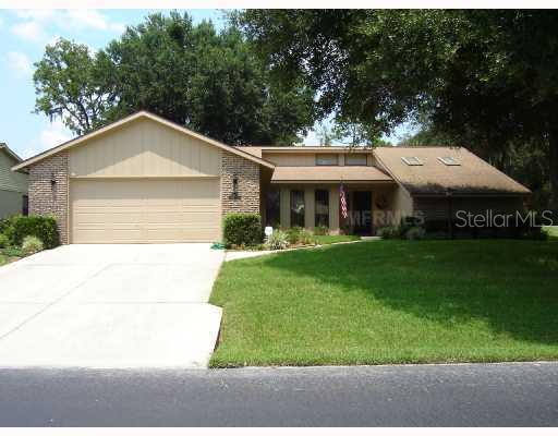 34409 Cedarfield Drive Ridge Manor, FL 33523 - Photo 1 of 1 Exterior Front - 3/2/2 IMMACULANT WELL MAINTAINED HOME ON AN ELEVATED LOT - SPLIT PLAN - ON A PAR 3 - TWO LARGE SHADE TREES ON A WELL GROOMED LAWN - GOLD CART & SOME FURNITURE CONVEYS - SKYLIGHTS - CLEAN BERBER CARPET