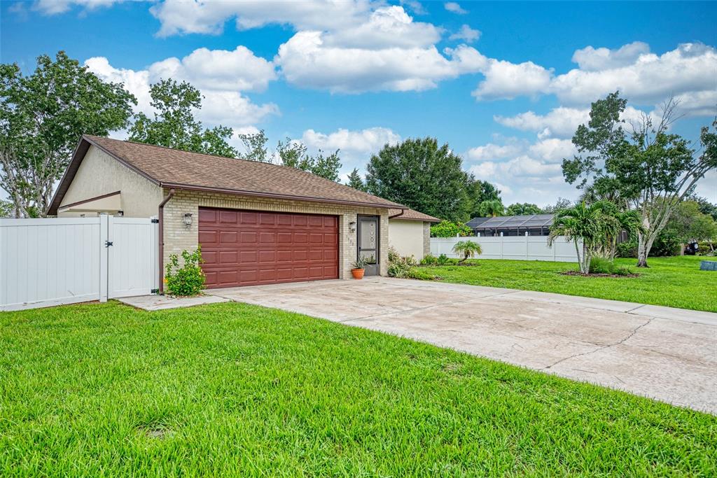 1330 Georgetowne Circle Sarasota, FL 34232 - Photo 3 of 46 a view of a house with a yard