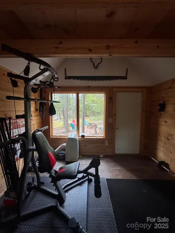 a kitchen with granite countertop a refrigerator a stove and wooden floor