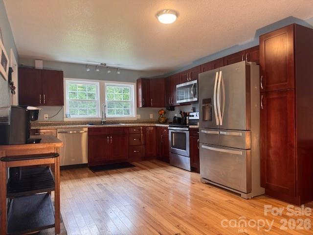 641 Camp Creek Road Union Mills, NC 28167 - Photo 8 of 29 a kitchen with granite countertop stainless steel appliances and wooden cabinets