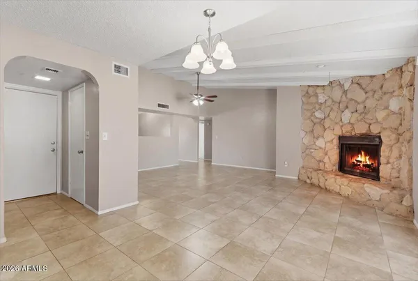 a view of an empty room and fire place